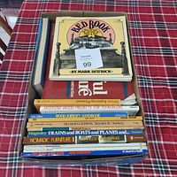 Box full of woodworking books showing titles and condition.