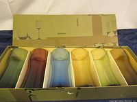 Original box showing six glasses separated by cardboard dividers