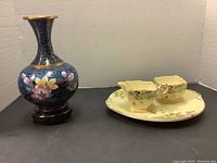 Overall lot showing cloisonné vase with Royal Winton cream, sugar, and cookie plate set