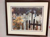 Full view of the framed limited edition print showing dark brown wooden frame, triple matting, and artwork of two blue jays on a white fence.