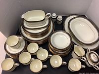 Full layout of plates, cups, saucers and serveware pieces