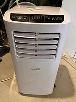 Front view of white ForestAir unit showing louvers and brand marking