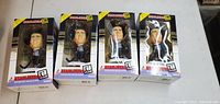 Four boxed NHL Headliners XL hockey player figures of Eric Lindros standing upright in boxes showing front window display.