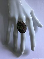 Ring shown worn on a white mannequin hand to display fit and scale.