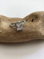 Front angle view showing the large emerald-cut crystal centerpiece and crystal-studded band