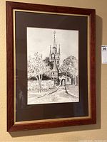 Full view of framed watercolor painting showing architecture and landscape