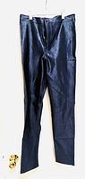 Full view of the dark blue shiny leggings hanging against a white background showing overall condition and fit.