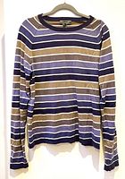 Front view of the sweater showing the full striped pattern and shape