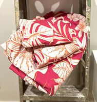 Folded duvet cover showing floral design in mauve and white colors.