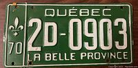 Front side of a 1970 Quebec license plate showing embossed green metal with white text including registration number 2D-0903 and 'LA BELLE PROVINCE'.