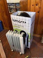 DeLonghi oil-filled heater positioned in front of Luma Comfort evaporative cooler box.