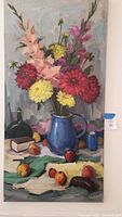 Full view of oil painting on stretched canvas showing a vibrant bouquet of flowers in a blue pitcher surrounded by fruit and assorted objects on a table.