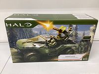Front view of the HALO Warthog toy vehicle boxed, showing artwork and branding.