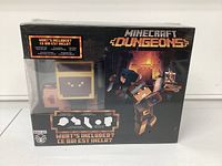 Front view of sealed Minecraft Dungeons collectible figure set in original box showing figure in pixelated style and branding.