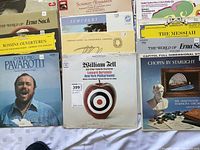 Photo displaying a selection of classical vinyl record covers including Pavarotti, Leonard Bernstein's William Tell, Chopin by Hollywood Symphony Orchestra, and others.