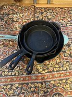 Top view of all four cast iron cookware pieces stacked