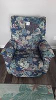 Front view showing seat, arms, and upholstery pattern
