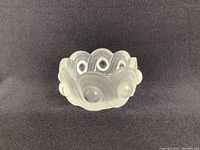 Front view of frosted crystal bowl with serpentine design, showing overall condition and shape.
