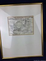 Framed artwork with camel sketch and signature visible