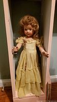Full view of 21" yellow dress Effenbee Anne Shirley doll in box