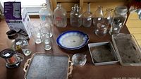 Photo showing entire collection with vintage milk bottles, glassware, trays, and boxed coffee maker