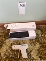 Photo of Huawei Starline Bluetooth speaker partially removed from box on carpet