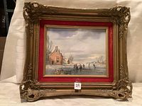 Front view of oil painting with ornate carved gilt wood frame and red velvet matting