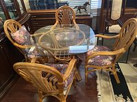Angled view of entire bamboo table and four chairs in room