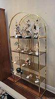 Front view of entire shelving unit loaded with decorative items