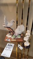 Photo showing both the 8-inch love birds statue and 5-inch lady figurine together on display.