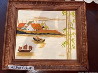 Full view of the signed EMagill painting in the carved wood frame showing the entire artwork and frame.