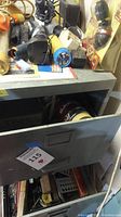 Drawer containing flashlights, electronic chargers, power cords, and handheld power tool adapters
