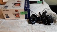 Sony DPP-FP75 photo printer box and walkie talkies on white cloth background