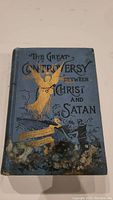 Front cover of the book showing the title with gold embossed dove, rays, and black detailing.