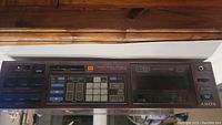 Front panel view of Sony STR-VX550 receiver showing buttons, control keys, and display screen.