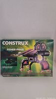 Front view of original box featuring the Fisher Price Construx Alien Series set with an assembled alien mech model graphic.