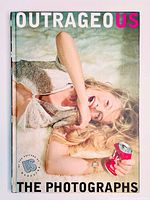 Front cover of the hardcover photography book featuring a female celebrity and title 'Outrageous: The Photographs'.