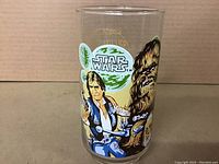 Front side of glass showing Han Solo and Chewbacca in vibrant color