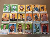 Full display of all 18 hockey cards laid out to view front of each card.