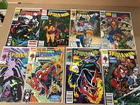 Photo showing all 8 Spider-Man comics laid out front, featuring prominent cover art with Spider-Man against various villains.