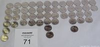 Photo of all 12 provincial quarter coins laid out with good lighting showing condition and details.