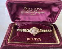 Bulova vintage women's wristwatch displayed inside original velvet box labeled 'Canada's Finest Timepieces Toronto'