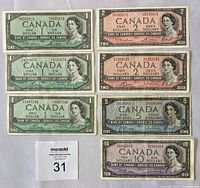 Six Canadian banknotes arranged in two columns, showing 3 one dollar notes on the left and 1 two dollar note, 1 five dollar note, 1 ten dollar note on the right.