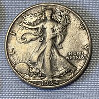Close-up of 1934 US Half Dollar coin obverse showing Walking Liberty design and date.
