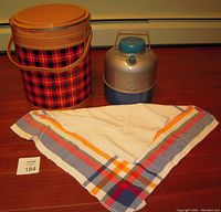 Full lot display showing Scotch Kooler, insulated drink container, and tablecloth spread out