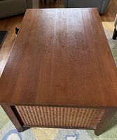 Top view of the rectangular mahogany stained wood coffee table showing surface finish and condition.