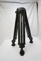 Full view of Manfrotto 546B aluminium twin leg tripod standing upright showing all three legs and tubular construction.