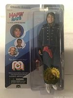 Photo of front packaging showing Chachi Arcola figure in black outfit with white shoes, included in Happy Days Mego 8 inch figure line