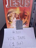 Front view of the VCR tape cover showing religious artwork and title with handwritten note indicating VCR tape set