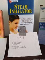 Front of the product box showing brand, product name, user image, and handwritten lot label.